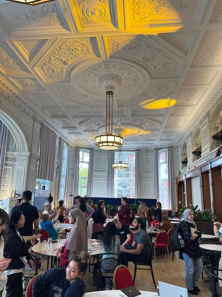 Students networking in an ornate hall at a Students' Union event